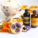 Orange Cookies with Edible Flowers Photo